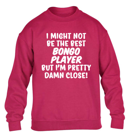 I might not be the best bongo player but I'm pretty close! children's pink sweater 12-14 Years