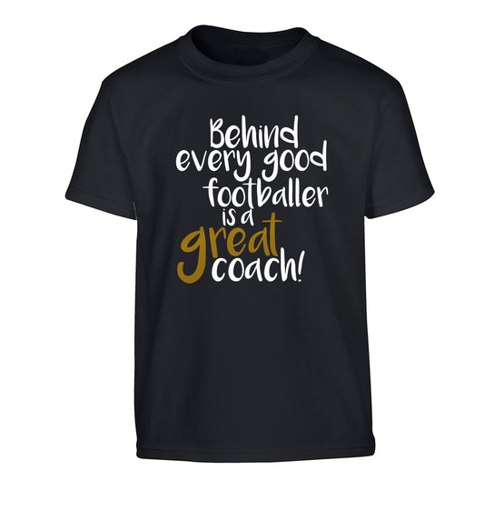 Behind every good footballer is a great coach! Children's black Tshirt 12-14 Years