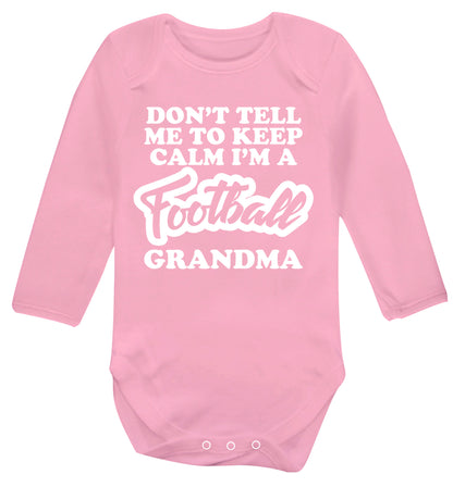 Don't tell me to keep calm I'm a football grandma Baby Vest long sleeved pale pink 6-12 months