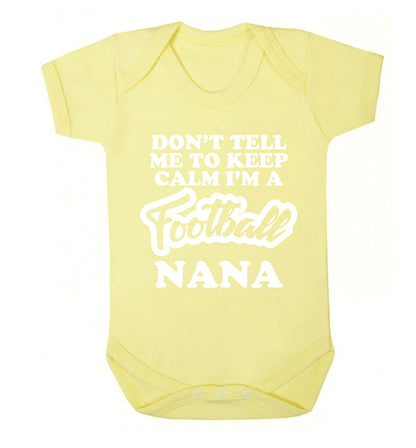 Don't tell me to keep calm I'm a football nana Baby Vest pale yellow 18-24 months