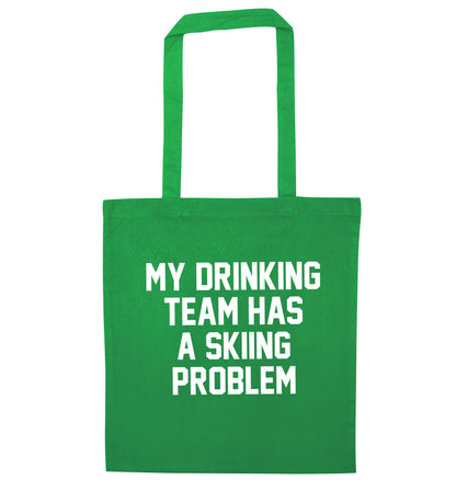 My drinking team has a skiing problem green tote bag