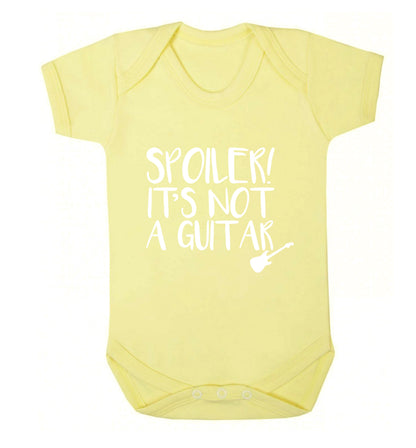 Spoiler it's not a guitar Baby Vest pale yellow 18-24 months
