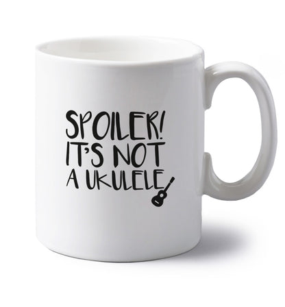 Spoiler it's not a ukulele left handed white ceramic mug 