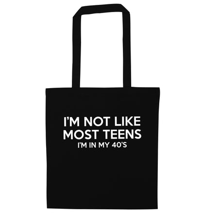 I'm not like most teens (I'm in my 40's) black tote bag