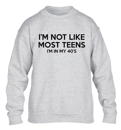 I'm not like most teens (I'm in my 40's) children's grey sweater 12-13 Years