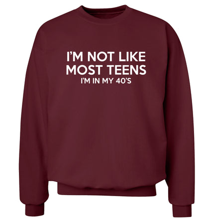 I'm not like most teens (I'm in my 40's) Adult's unisex maroon Sweater 2XL