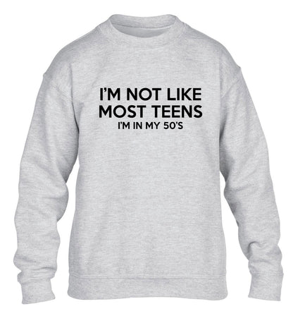 I'm not like most teens (I'm in my 50's) children's grey sweater 12-13 Years