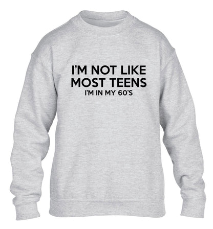I'm not like most teens (I'm in my 60's) children's grey sweater 12-13 Years