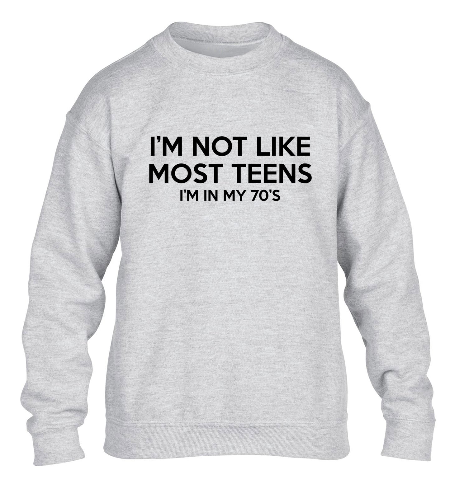 I'm not like most teens (I'm in my 70's) children's grey sweater 12-13 Years