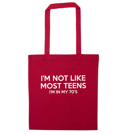 I'm not like most teens (I'm in my 70's) red tote bag