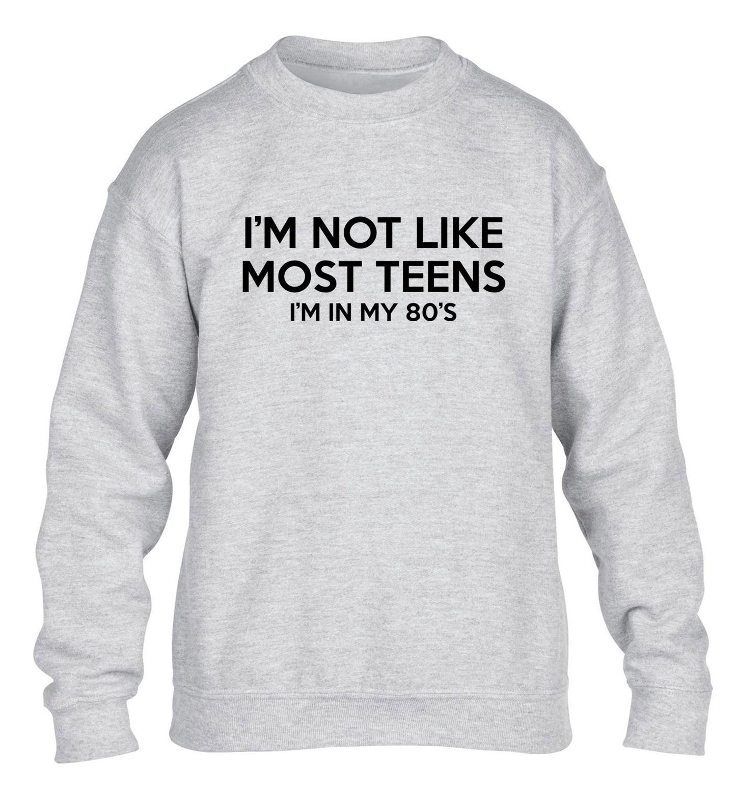 I'm not like most teens (I'm in my 80's) children's grey sweater 12-13 Years