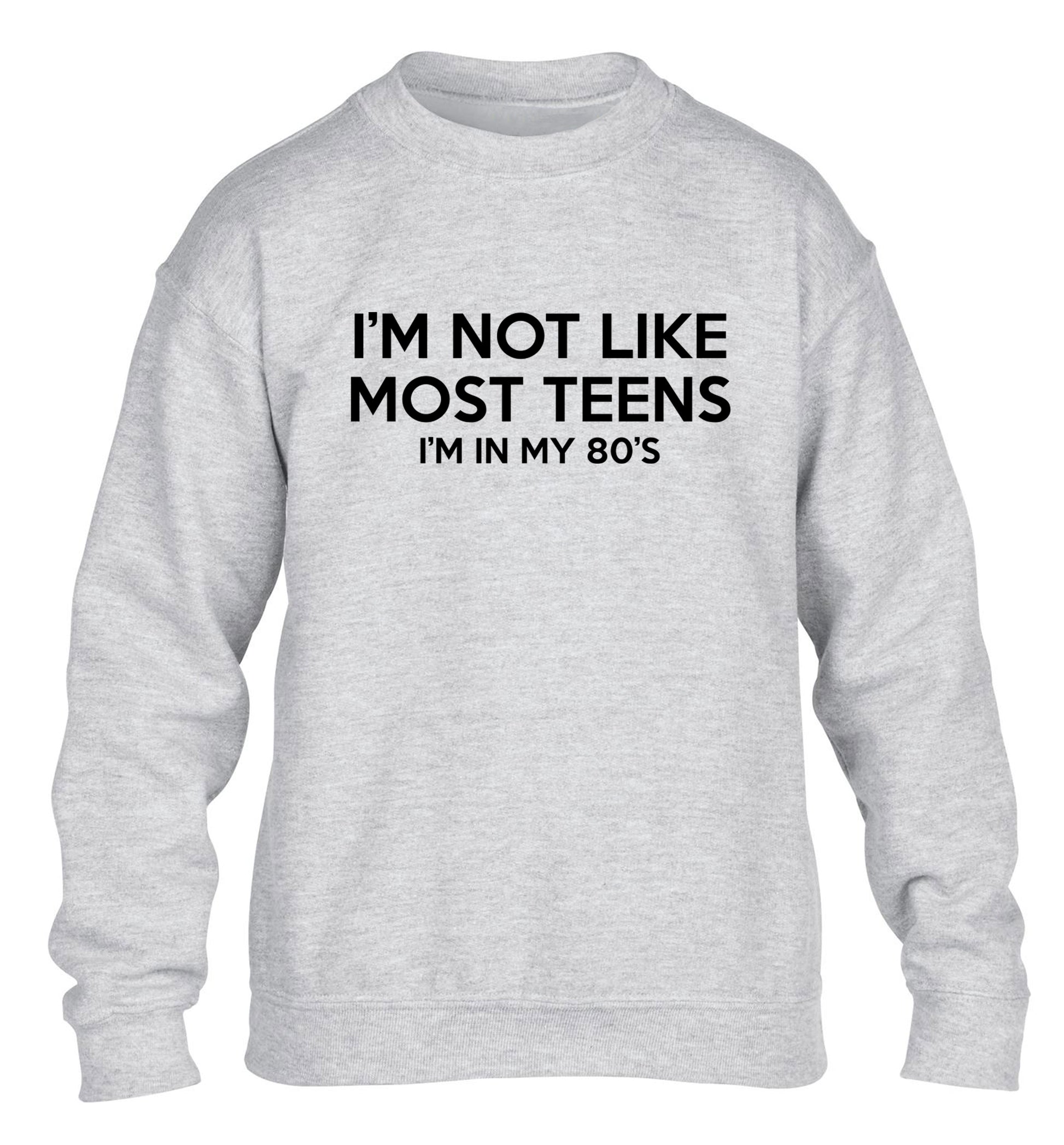 I'm not like most teens (I'm in my 80's) children's grey sweater 12-13 Years