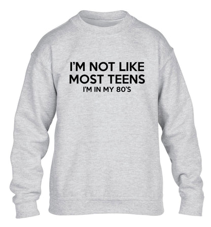 I'm not like most teens (I'm in my 80's) children's grey sweater 12-13 Years