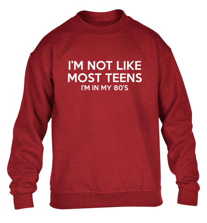 I'm not like most teens (I'm in my 80's) children's grey sweater 12-13 Years