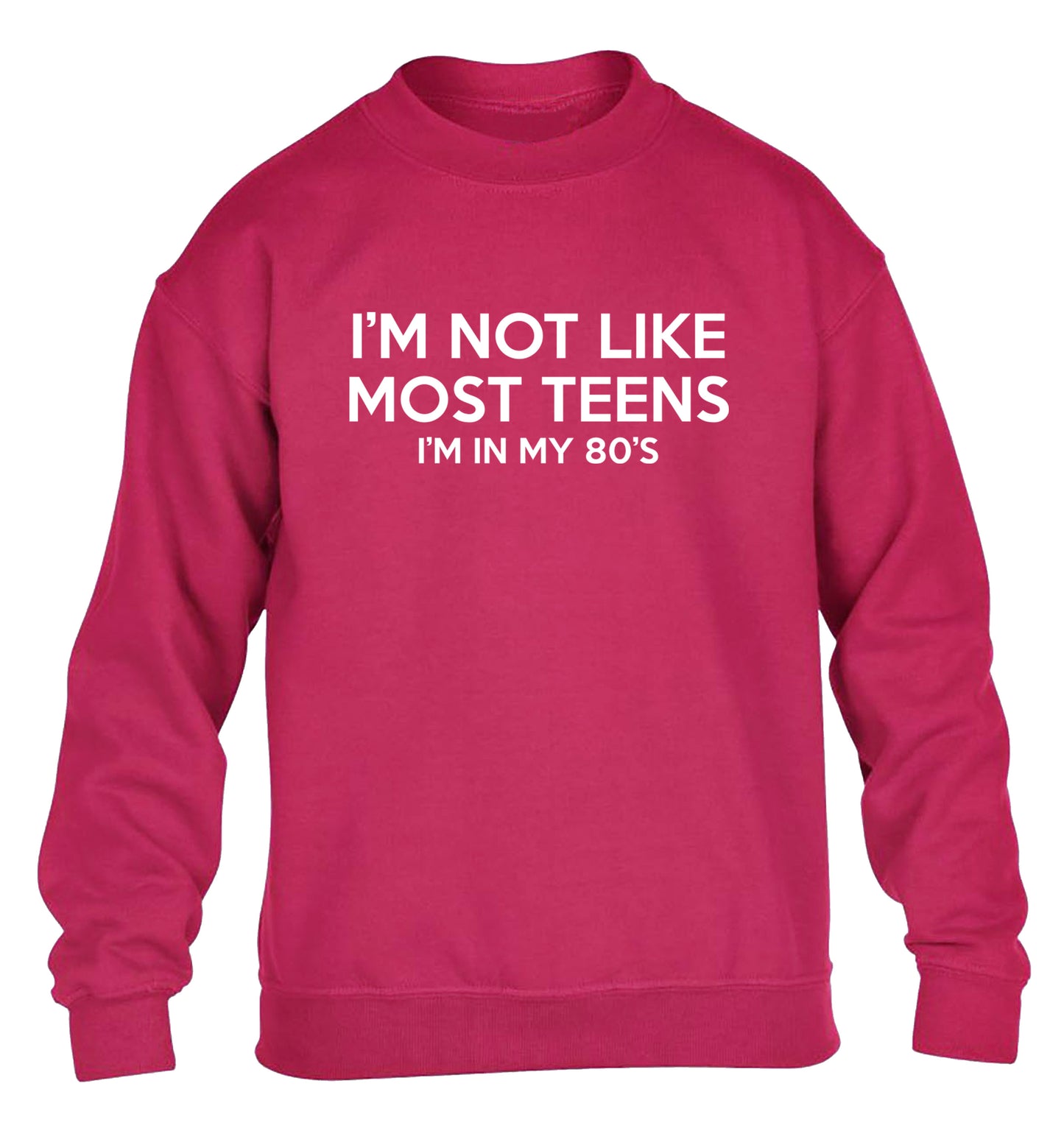 I'm not like most teens (I'm in my 80's) children's pink sweater 12-13 Years