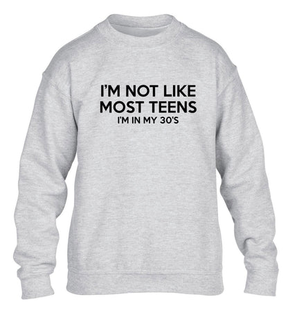I'm not like most teens (I'm in my 30's) children's grey sweater 12-13 Years