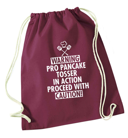 Warning pro pancake tosser in action proceed with caution maroon drawstring bag