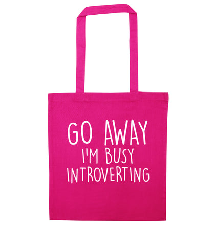Go away I'm busy introverting pink tote bag