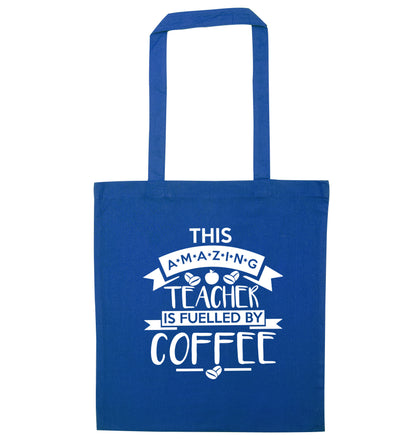 This amazing teacher is fuelled by coffee blue tote bag