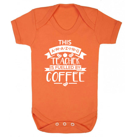 This amazing teacher is fuelled by coffee Baby Vest orange 18-24 months