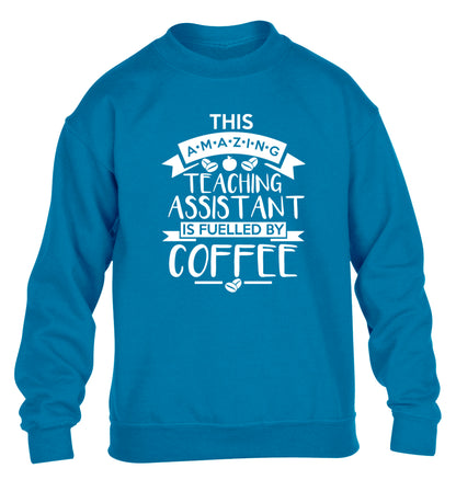 This amazing teaching assistant is fuelled by coffee children's blue sweater 12-13 Years