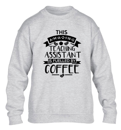 This amazing teaching assistant is fuelled by coffee children's grey sweater 12-13 Years