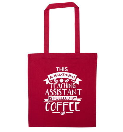 This amazing teaching assistant is fuelled by coffee red tote bag