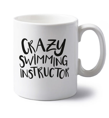 Crazy swimming instructor left handed white ceramic mug 