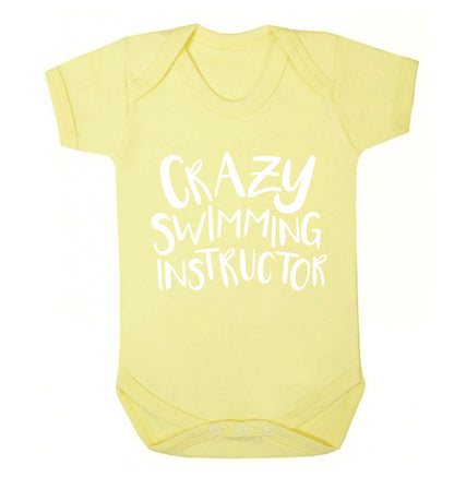 Crazy swimming instructor Baby Vest pale yellow 18-24 months