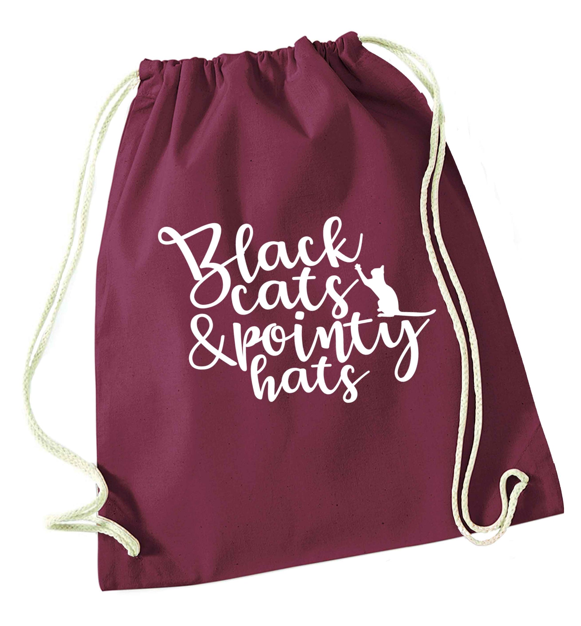 Black cats and pointy hats maroon drawstring bag