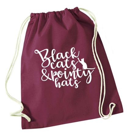 Black cats and pointy hats maroon drawstring bag