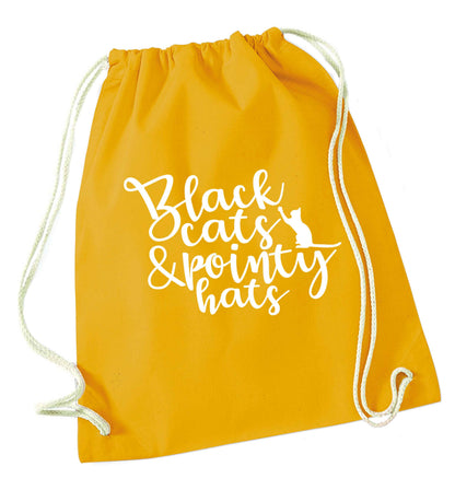 Black cats and pointy hats mustard drawstring bag