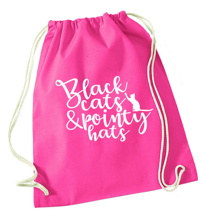 Black cats and pointy hats pink drawstring bag