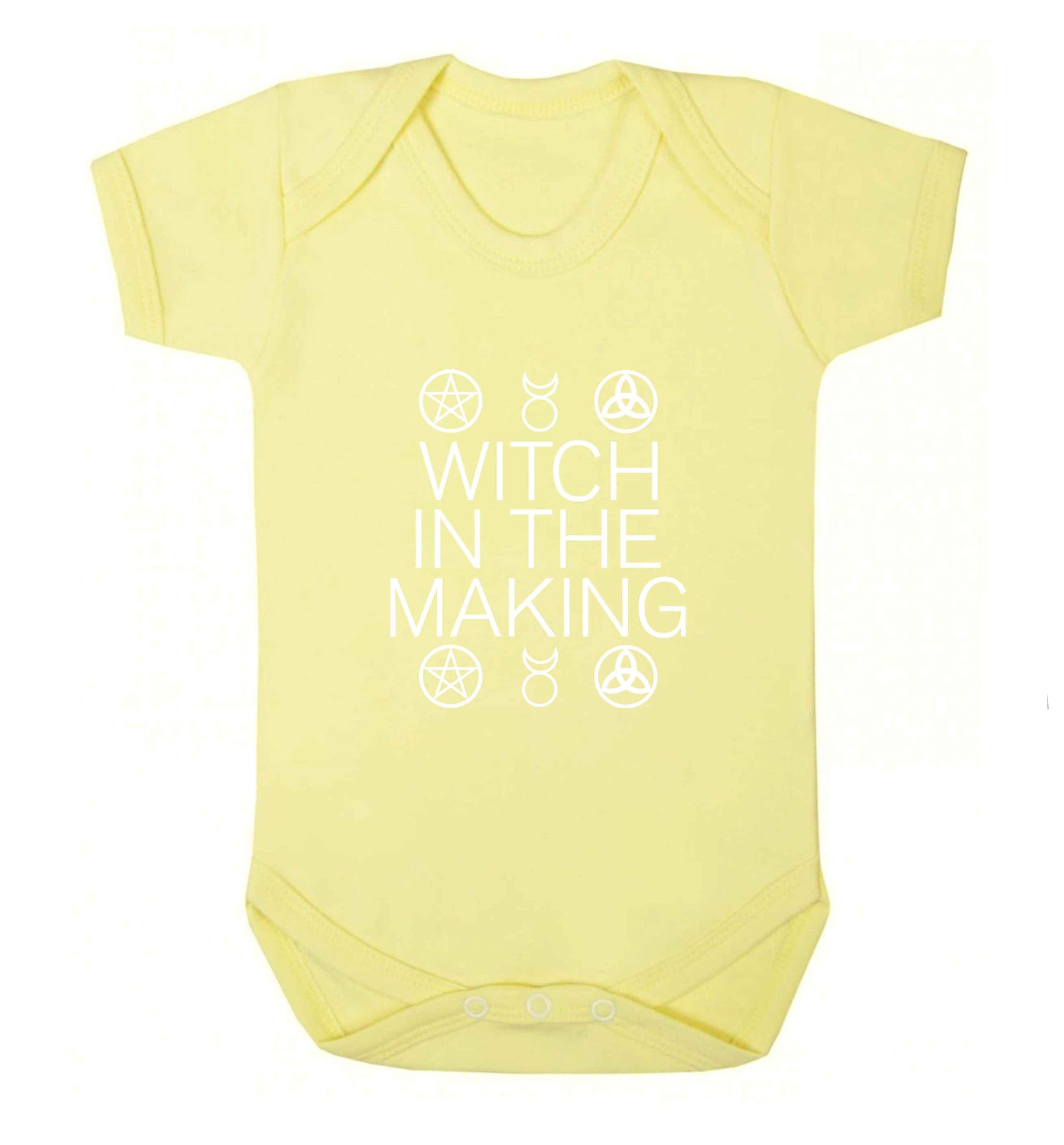 Witch in the making baby vest pale yellow 18-24 months
