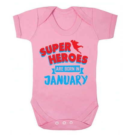 Superheros are born in January Baby Vest pale pink 18-24 months