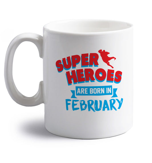 superheroes are born in February right handed white ceramic mug 