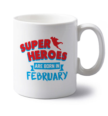 superheroes are born in February left handed white ceramic mug 