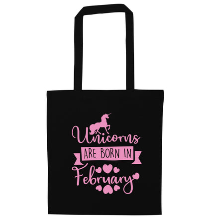 Unicorns are born in February black tote bag