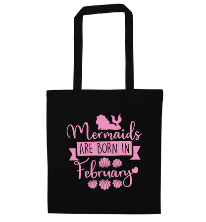 Mermaids are born in February black tote bag