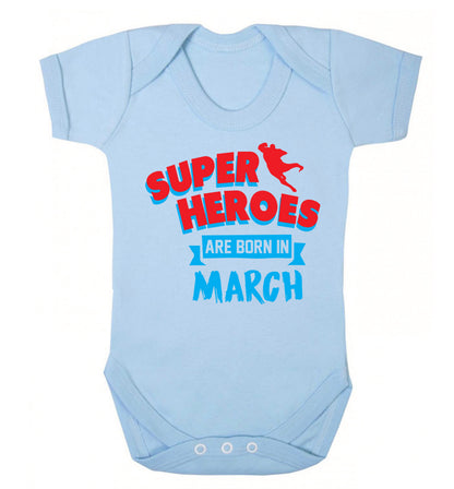 Superheros are born in March Baby Vest pale blue 18-24 months