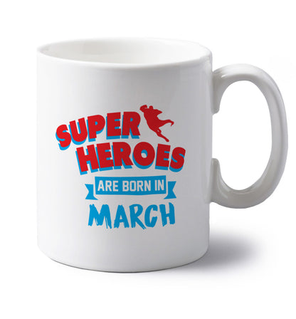 Superheros are born in March left handed white ceramic mug 
