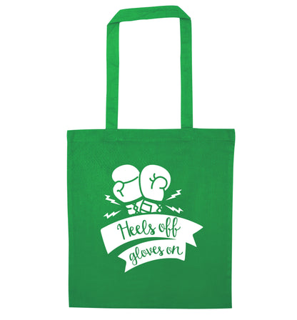 Heels off gloves on green tote bag