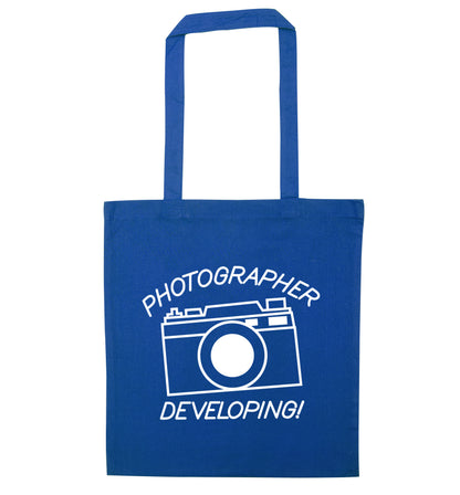 Photographer Developing  blue tote bag