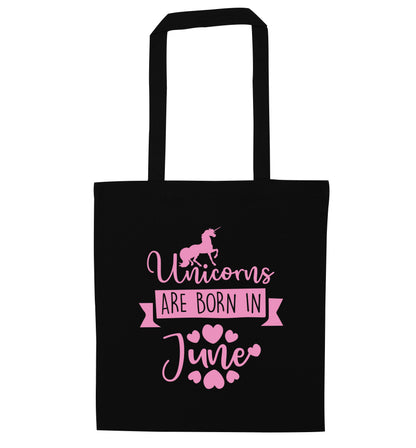 Unicorns are born in June black tote bag