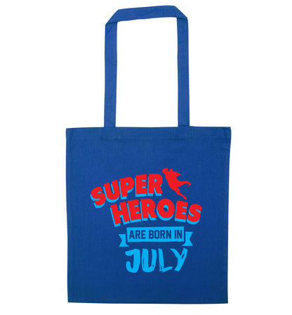 Superheroes are born in July blue tote bag
