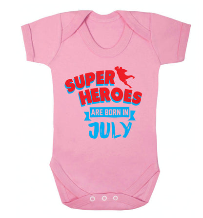 Superheroes are born in July Baby Vest pale pink 18-24 months