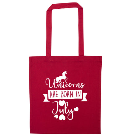 Unicorns are born in July red tote bag