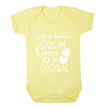 My godmother sends me kisses from overseas Baby Vest pale yellow 18-24 months