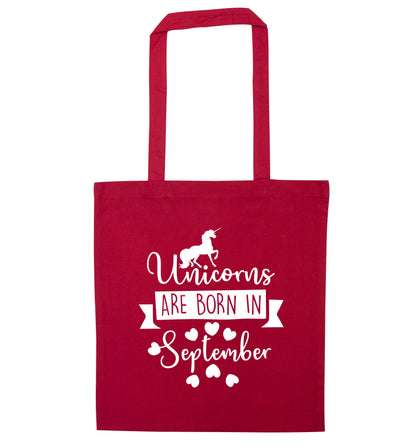 Unicorns are born in September red tote bag