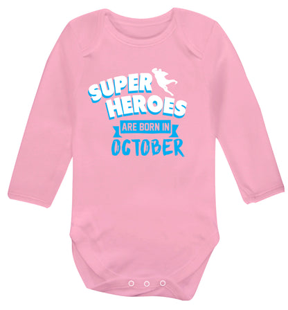 Superheroes are born in October Baby Vest long sleeved pale pink 6-12 months